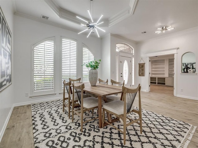 1340 NW 168th St, Edmond, OK 73012 - dining room with light wood-style flooring, healthy amount of natural light, crown molding, and a chandelier