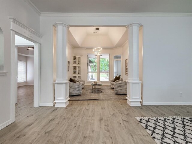 1340 NW 168th St, Edmond, OK 73012 - living area featuring decorative columns, wood finished floors, ornamental molding, and a tray ceiling