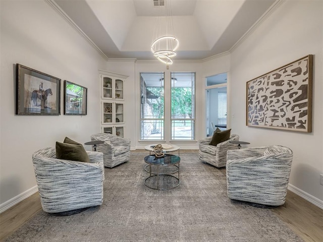 1340 NW 168th St, Edmond, OK 73012 - living area featuring a chandelier, wood finished floors, and ornamental molding