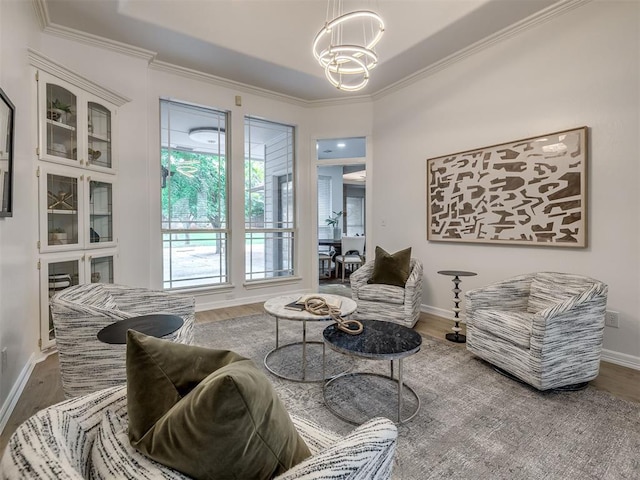 1340 NW 168th St, Edmond, OK 73012 - living room featuring a chandelier, wood finished floors, and crown molding