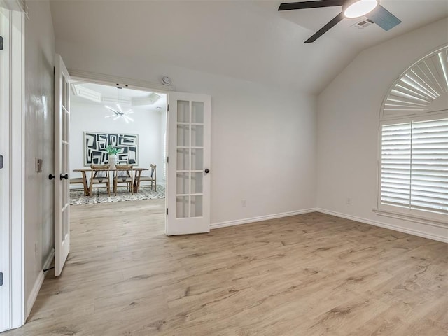 1340 NW 168th St, Edmond, OK 73012 - empty room featuring ceiling fan, french doors, lofted ceiling, and light wood-type flooring