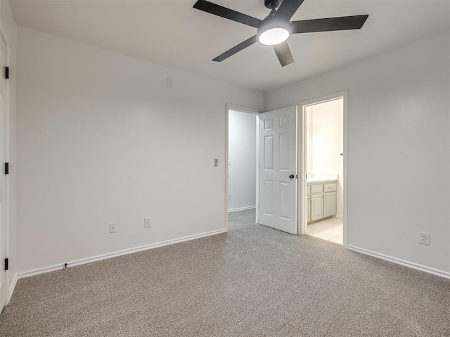 1340 NW 168th St, Edmond, OK 73012 - unfurnished bedroom featuring light colored carpet, connected bathroom, and a ceiling fan