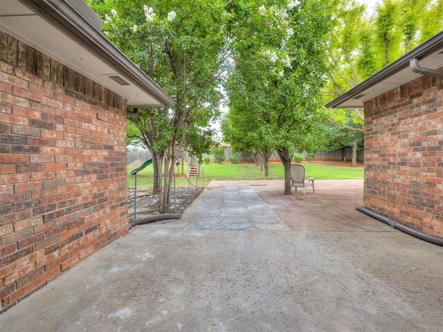 1340 NW 168th St, Edmond, OK 73012 - fenced backyard featuring a patio