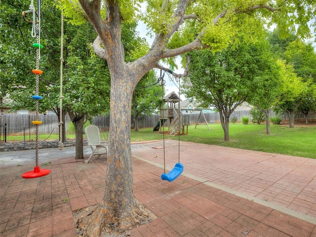 1340 NW 168th St, Edmond, OK 73012 - fenced backyard with a playground and a patio