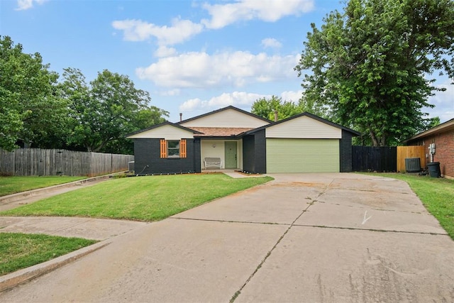 3300 Outpost Cir, Norman, OK 73072 - view of front of house with driveway, a garage, and brick siding