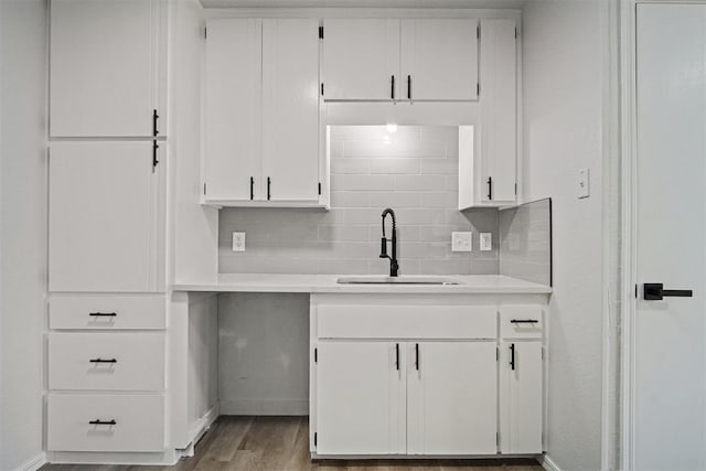 3300 Outpost Cir, Norman, OK 73072 - kitchen featuring white cabinetry, light countertops, wood finished floors, and decorative backsplash