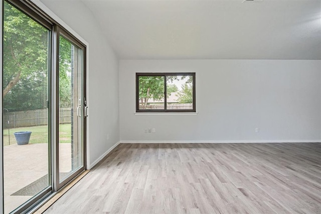 3300 Outpost Cir, Norman, OK 73072 - unfurnished room featuring wood finished floors and lofted ceiling