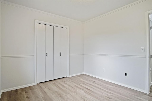 3300 Outpost Cir, Norman, OK 73072 - unfurnished bedroom with light wood-style floors, a closet, and crown molding