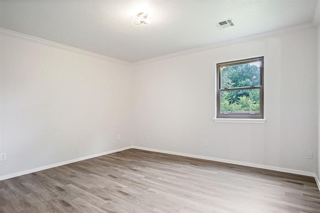 3300 Outpost Cir, Norman, OK 73072 - spare room with wood finished floors and ornamental molding