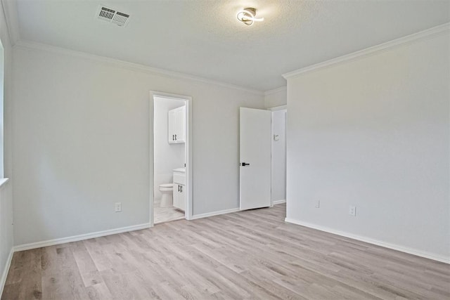 3300 Outpost Cir, Norman, OK 73072 - empty room featuring ornamental molding, wood finished floors, and a textured ceiling
