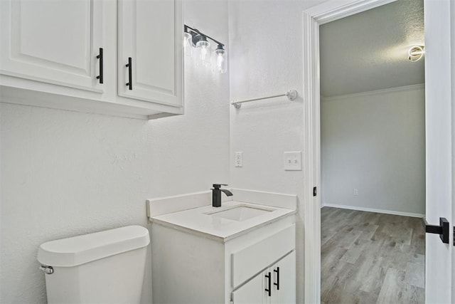 3300 Outpost Cir, Norman, OK 73072 - bathroom featuring vanity, wood finished floors, and crown molding