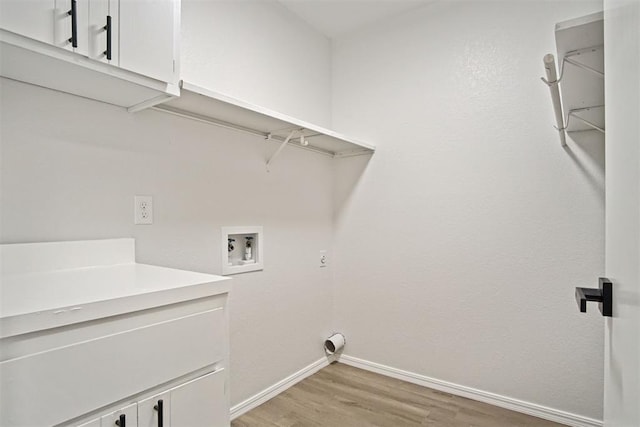 3300 Outpost Cir, Norman, OK 73072 - laundry room featuring cabinet space, washer hookup, and light wood-type flooring