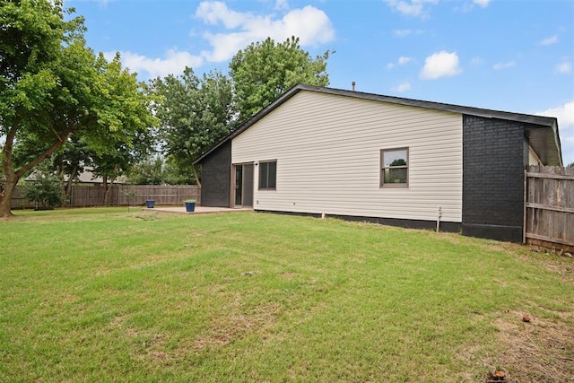 3300 Outpost Cir, Norman, OK 73072 - rear view of property with a fenced backyard and brick siding