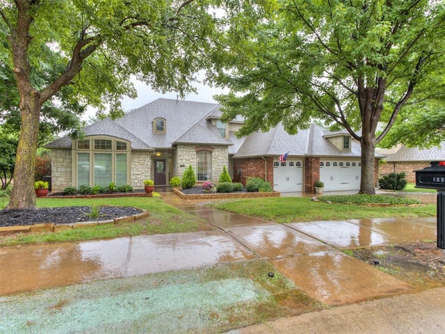 123 E Lakeview Trl, Edmond, OK 73003 - french country home featuring stone siding