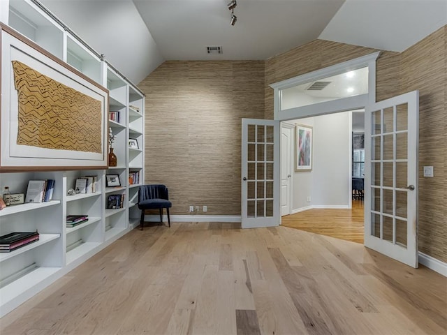 123 E Lakeview Trl, Edmond, OK 73003 - sitting room featuring french doors, vaulted ceiling, and light wood-type flooring