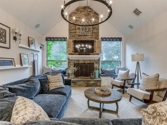 123 E Lakeview Trl, Edmond, OK 73003 - living area with high vaulted ceiling, a chandelier, and a stone fireplace