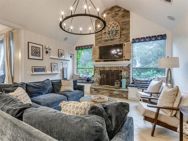 123 E Lakeview Trl, Edmond, OK 73003 - living area with a chandelier, high vaulted ceiling, and a stone fireplace