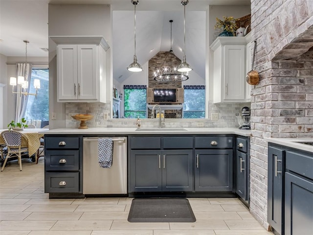 123 E Lakeview Trl, Edmond, OK 73003 - kitchen with dishwasher, a chandelier, white cabinetry, light countertops, and vaulted ceiling