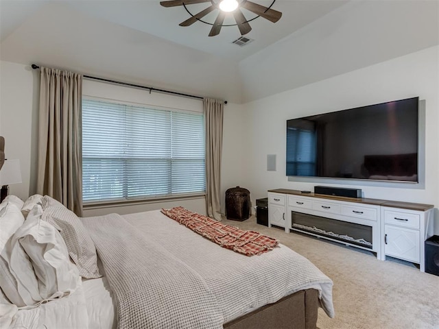 123 E Lakeview Trl, Edmond, OK 73003 - bedroom featuring light carpet, vaulted ceiling, and a ceiling fan