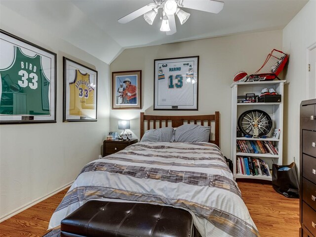 123 E Lakeview Trl, Edmond, OK 73003 - bedroom with wood finished floors, lofted ceiling, and a ceiling fan