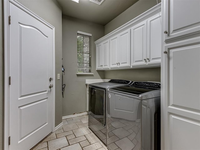 123 E Lakeview Trl, Edmond, OK 73003 - laundry area with cabinet space and washer and dryer