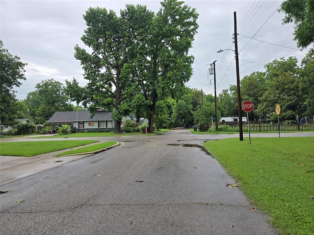 730 N Santa Fe St Unit 4052073333, Pauls Valley, OK 73075 - view of asphalt road featuring traffic signs and street lights