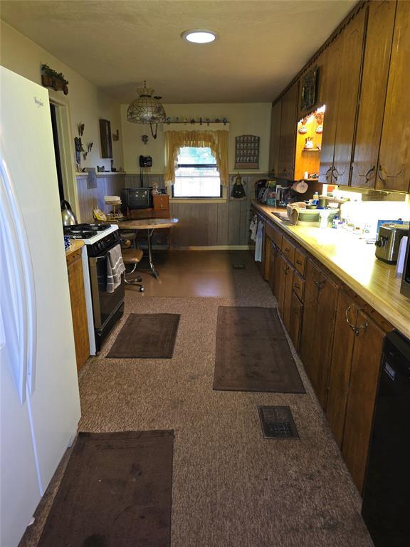 730 N Santa Fe St Unit 4052073333, Pauls Valley, OK 73075 - kitchen with freestanding refrigerator, gas range, black dishwasher, light countertops, and recessed lighting