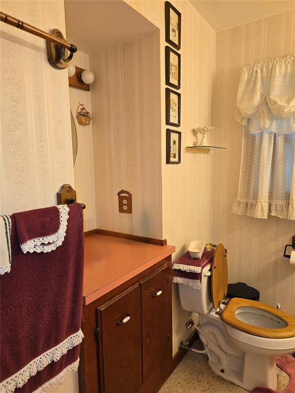730 N Santa Fe St Unit 4052073333, Pauls Valley, OK 73075 - bathroom with toilet and wallpapered walls