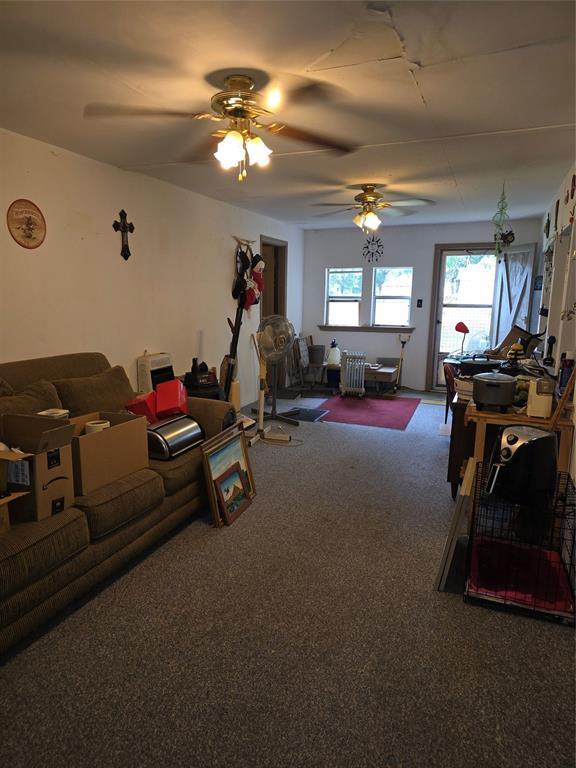 730 N Santa Fe St Unit 4052073333, Pauls Valley, OK 73075 - carpeted living area with ceiling fan
