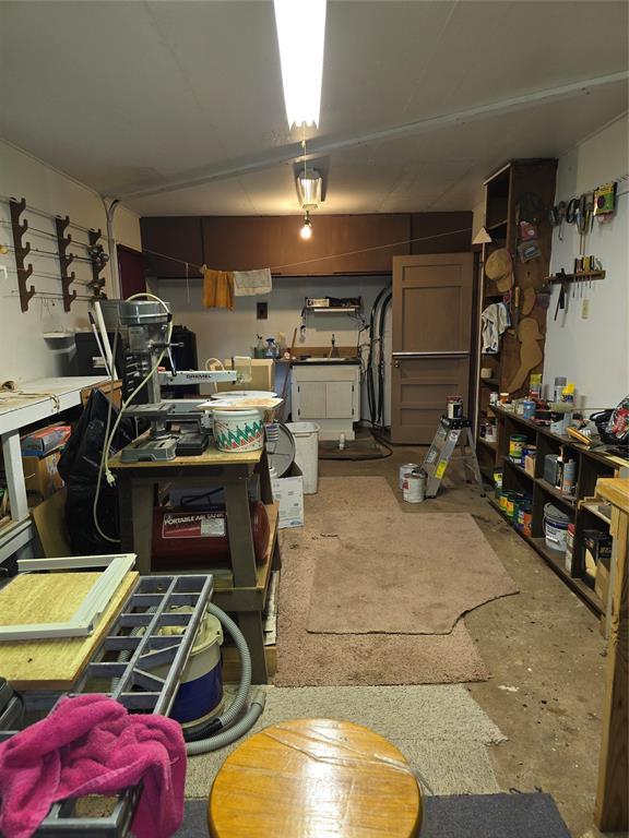 730 N Santa Fe St Unit 4052073333, Pauls Valley, OK 73075 - garage featuring a workshop area