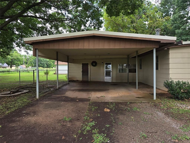 730 N Santa Fe St Unit 4052073333, Pauls Valley, OK 73075 - view of parking featuring asphalt driveway and an attached carport