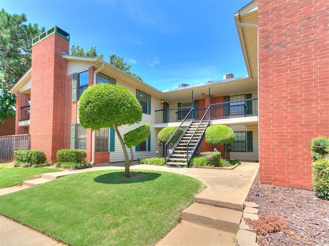4400 Hemingway Dr Unit 221, Oklahoma City, OK 73118 - view of building exterior featuring stairs