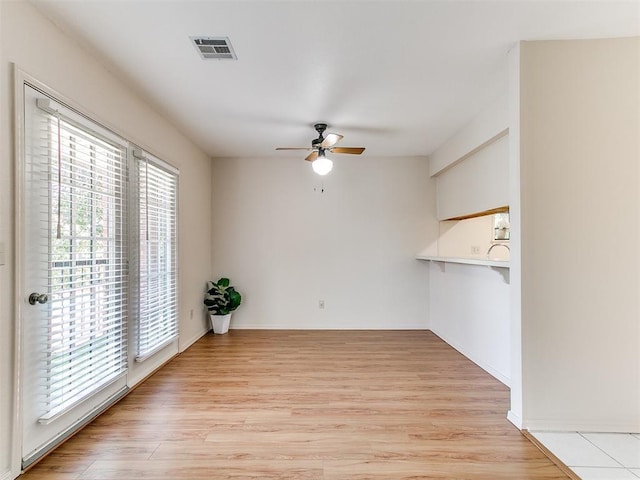 4400 Hemingway Dr Unit 221, Oklahoma City, OK 73118 - spare room with a ceiling fan and light wood-style floors