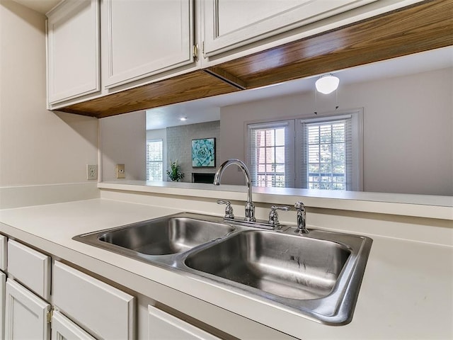 4400 Hemingway Dr Unit 221, Oklahoma City, OK 73118 - kitchen with light countertops and white cabinetry