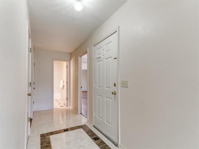 4400 Hemingway Dr Unit 221, Oklahoma City, OK 73118 - foyer featuring light tile patterned floors and baseboards