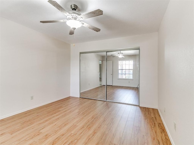 4400 Hemingway Dr Unit 221, Oklahoma City, OK 73118 - unfurnished bedroom with light wood-style floors, a closet, and ceiling fan