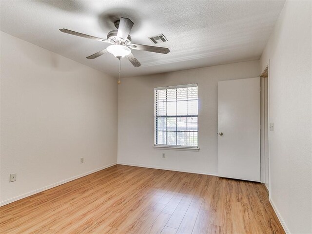 4400 Hemingway Dr Unit 221, Oklahoma City, OK 73118 - empty room with light wood-style flooring and a ceiling fan