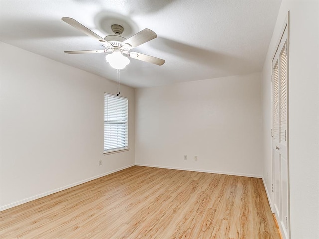 4400 Hemingway Dr Unit 221, Oklahoma City, OK 73118 - unfurnished room featuring light wood-style flooring and a ceiling fan