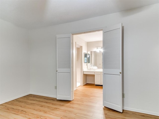 4400 Hemingway Dr Unit 221, Oklahoma City, OK 73118 - empty room featuring light wood-style floors and baseboards
