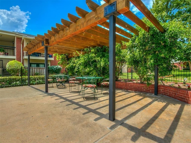 4400 Hemingway Dr Unit 221, Oklahoma City, OK 73118 - view of patio / terrace featuring a pergola and outdoor dining space