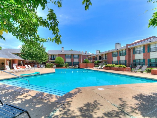 4400 Hemingway Dr Unit 221, Oklahoma City, OK 73118 - community pool featuring a patio and a residential view