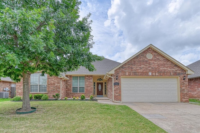 3900 Irvine Dr, Norman, OK 73072 - view of front facade featuring driveway, a front lawn, a garage, and brick siding