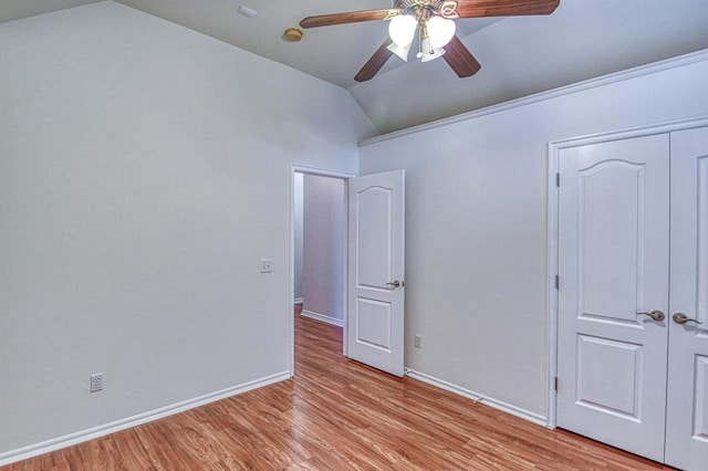 3900 Irvine Dr, Norman, OK 73072 - unfurnished bedroom with vaulted ceiling, light wood-style flooring, a closet, and a ceiling fan