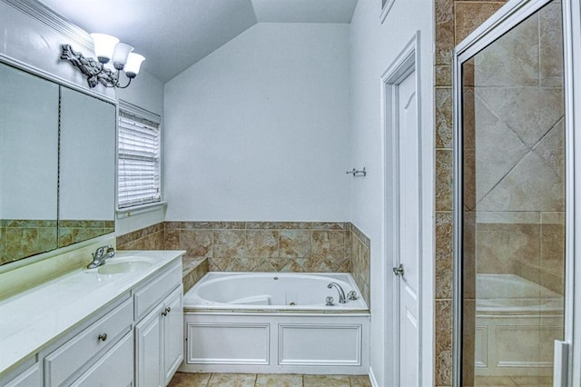 3900 Irvine Dr, Norman, OK 73072 - full bath with vanity, a garden tub, a shower stall, vaulted ceiling, and a chandelier