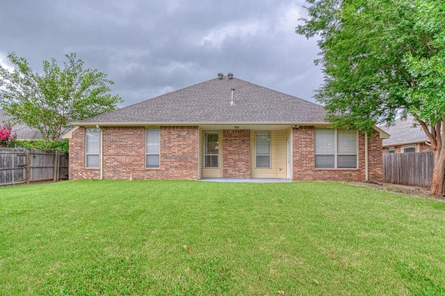 3900 Irvine Dr, Norman, OK 73072 - rear view of property featuring a fenced backyard, a patio, brick siding, and a shingled roof