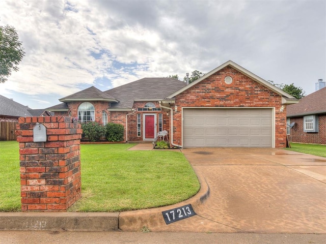 17213 Sunny Hollow Rd, Edmond, OK 73012 - view of front of house with brick siding, an attached garage, a front lawn, concrete driveway, and roof with shingles