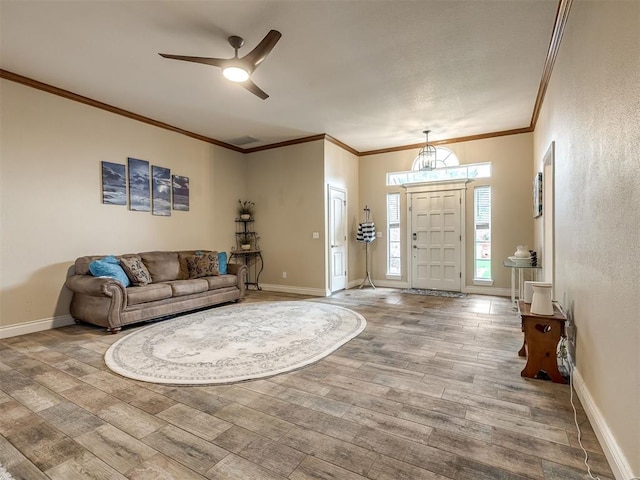 17213 Sunny Hollow Rd, Edmond, OK 73012 - living area with wood finished floors, ornamental molding, and a ceiling fan