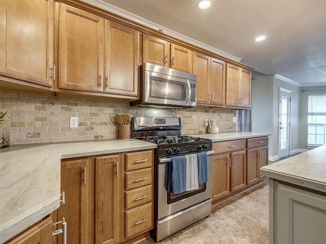 17213 Sunny Hollow Rd, Edmond, OK 73012 - kitchen with appliances with stainless steel finishes, ornamental molding, backsplash, brown cabinetry, and recessed lighting