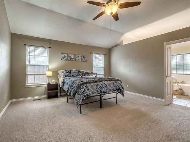 17213 Sunny Hollow Rd, Edmond, OK 73012 - bedroom featuring carpet, lofted ceiling, ensuite bath, and ceiling fan