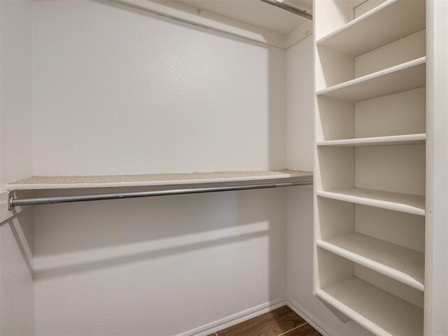 17213 Sunny Hollow Rd, Edmond, OK 73012 - walk in closet with dark wood finished floors